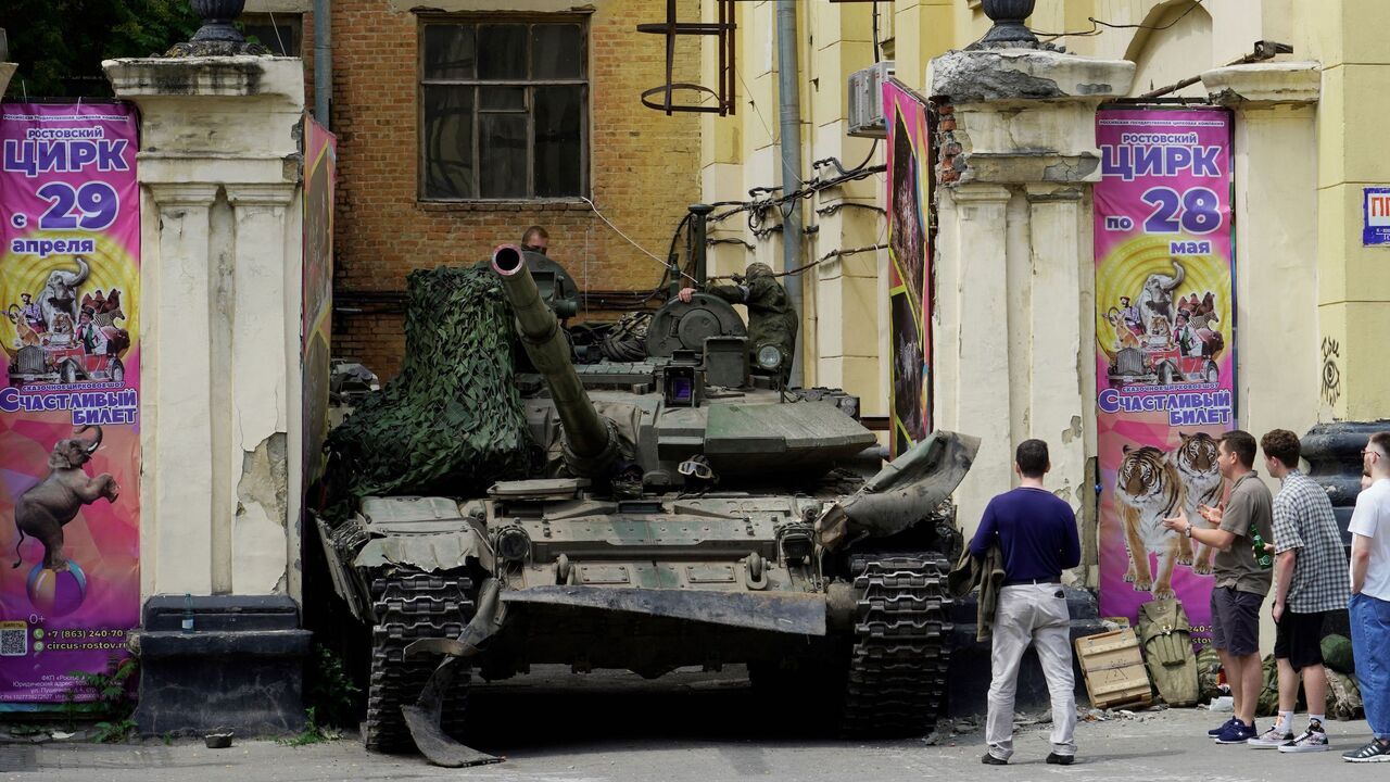 People look at a tank near a circus building in the city of Rostov-on-Don, on June 24, 2023.