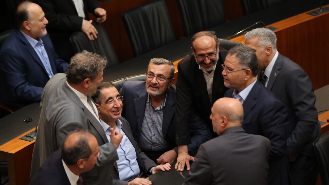 Lebanese lawmakers speak prior to the start of the 12th parliamentary session to elect a new president