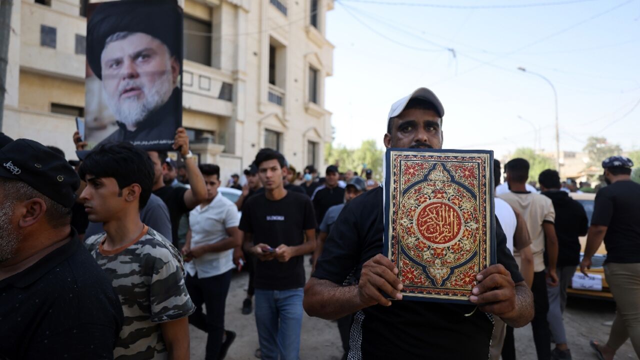 Supporters of Iraqi firebrand Shiite cleric Moqtada Sadr protest outside the Swedish embassy in Baghdad 