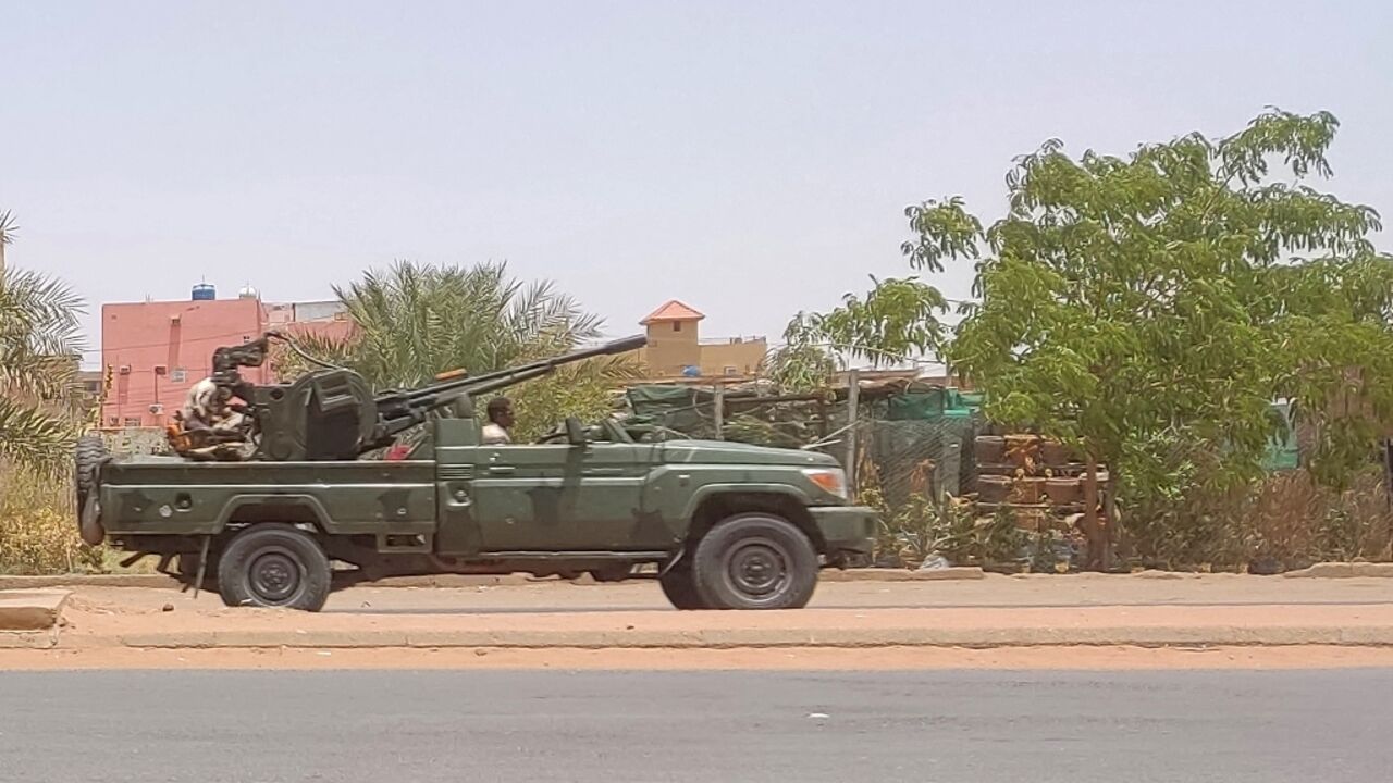 Fighters of the paramilitary Rapid Support Forces (RSF) drive an armoured vehicle in southern Khartoum, on May 25, 2023 Fighters of the paramilitary Rapid Support Forces (RSF) drive an armoured vehicle in southern Khartoum, on May 25, 2023