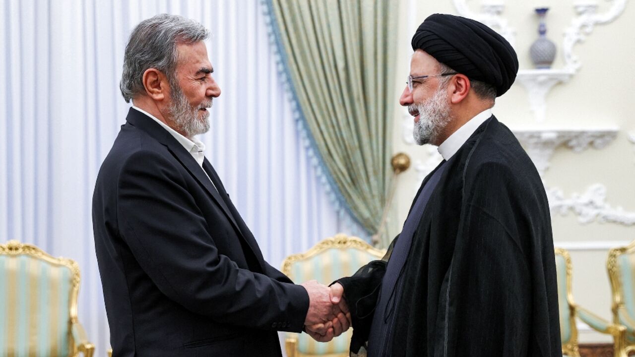 Iran's President Ebrahim Raisi (R) receives Ziad al-Nakhala, Secretary-General of the Palestinian Islamic Jihad movement Iran's President Ebrahim Raisi (R) receives Ziad al-Nakhala, Secretary-General of the Palestinian Islamic Jihad movement
