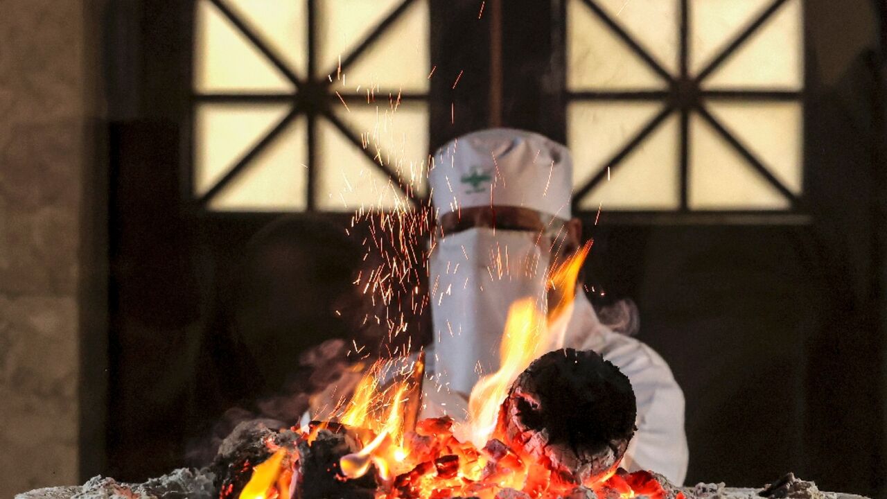A Zoroastrian priest adds wood to the Atash Bahram ("Fire of Victory" or Eternal Flame) in the sanctum at the Fire Temple of Yazd in central Iran A Zoroastrian priest adds wood to the Atash Bahram ("Fire of Victory" or Eternal Flame) in the sanctum at the Fire Temple of Yazd in central Iran