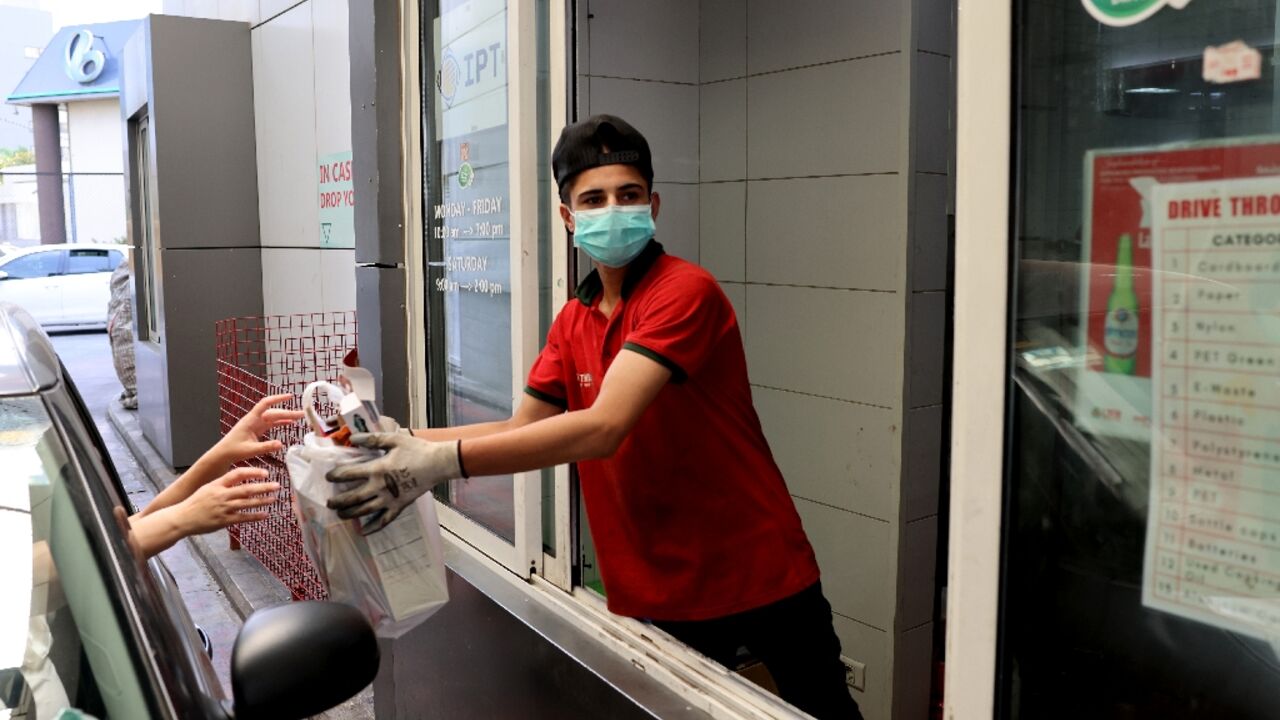 Drivers exchange empty bottles and cardboard for cash, easing both Lebanon's garbage crisis and rampant poverty