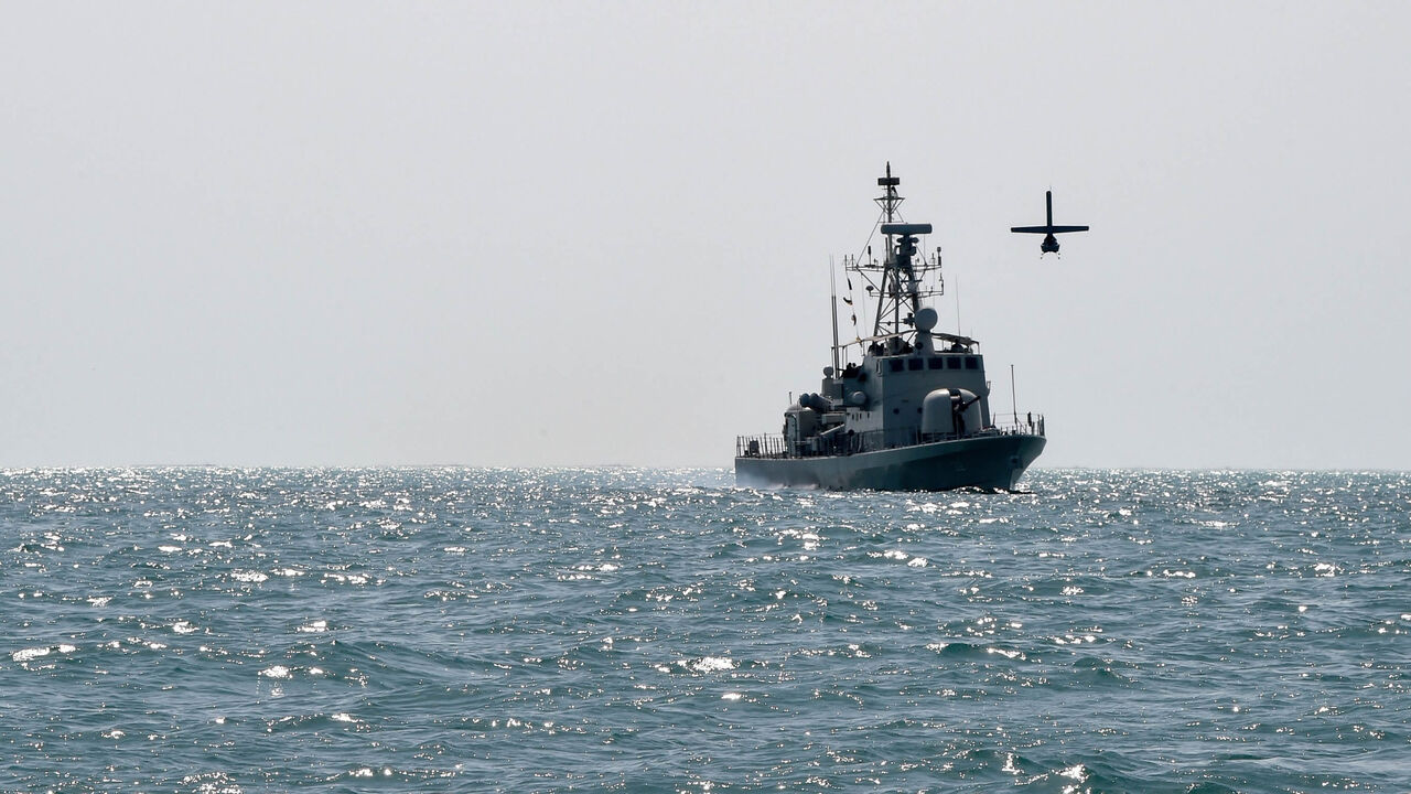 A US Navy Martin UAV drone flies over the Gulf waters as Royal Bahrain Naval Force Abdulrahman Al Fadhel takes part in joint naval exercise between US 5th Fleet Command and Bahraini forces, Oct. 26, 2021.