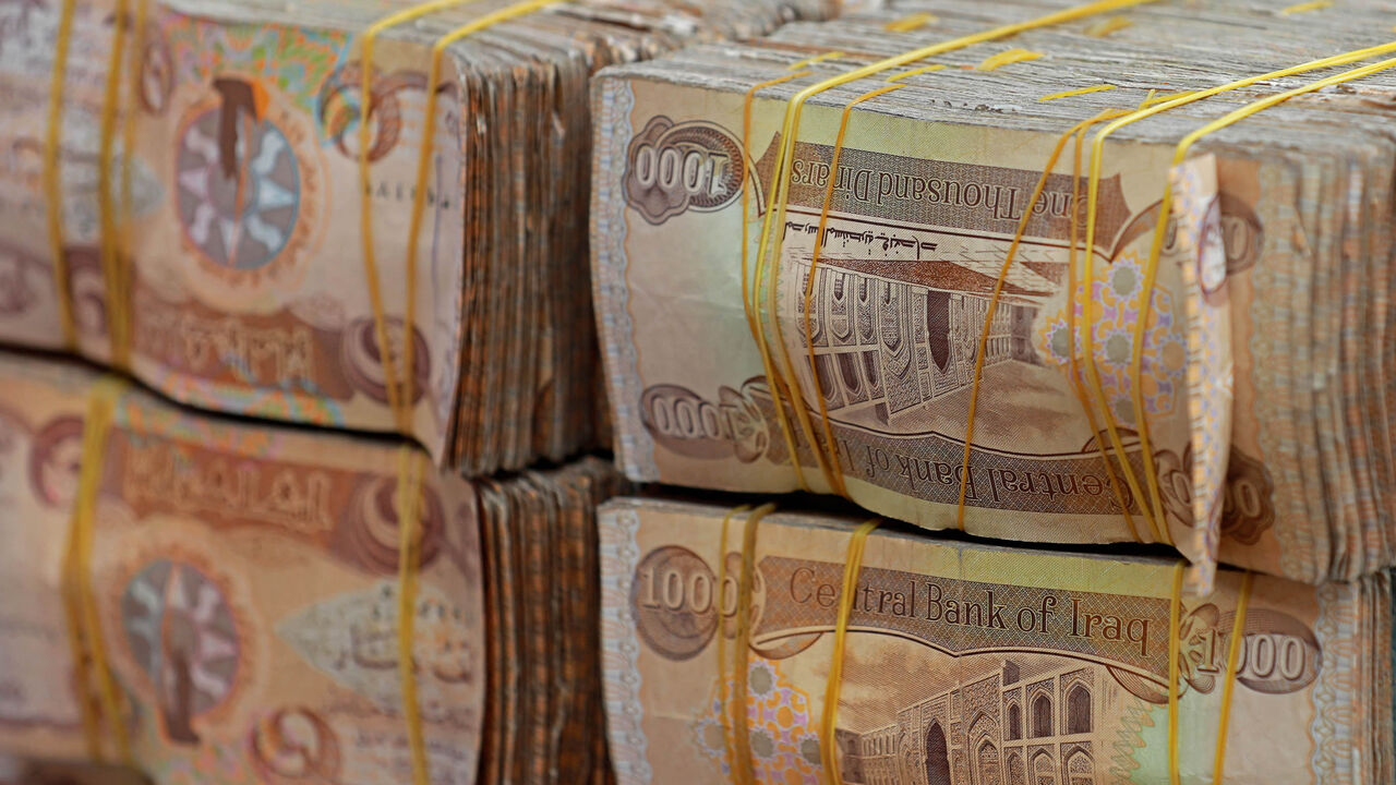 Stacks of Iraqi dinars are seen at a currency exchange shop, Baghdad, Iraq, Feb. 14, 2023.