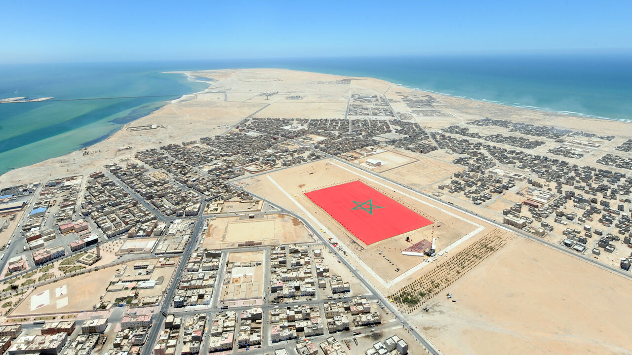 An aerial view shows a Moroccan flag measuring 60,000 square metres (645,835 square foot) and weighing 20 tonnes in the town of Dakhla, on May 8, 2010. The flag is an attempt to beat the record for the World's largest flag, a record which is currently held by Israel. AFP PHOTO/AIDA (Photo by AFP) (Photo by -/AFP via Getty Images)