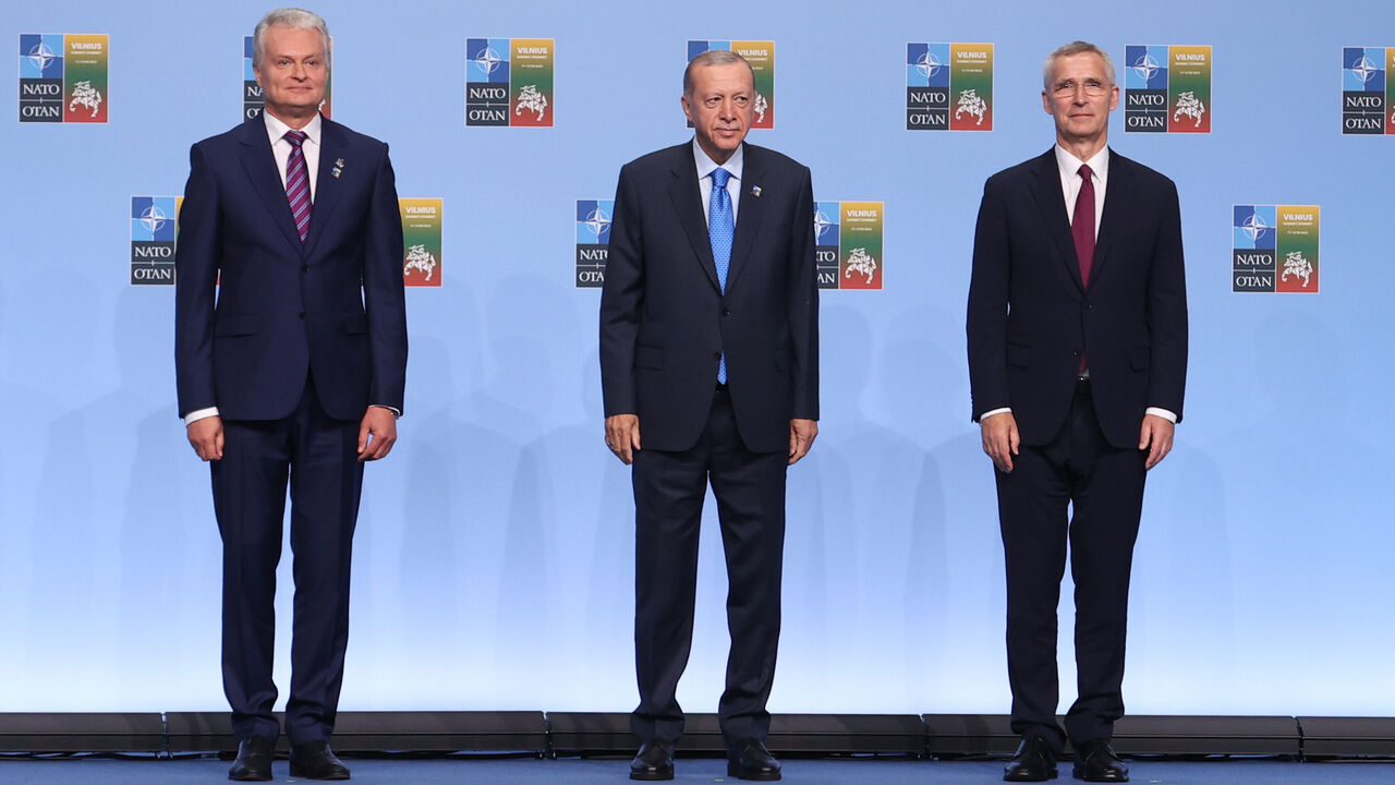 President of Lithuania Gitanas Nauseda, Turkish President Recep Tayyip Erdogan and NATO Secretary-General Jens Stoltenberg (R).