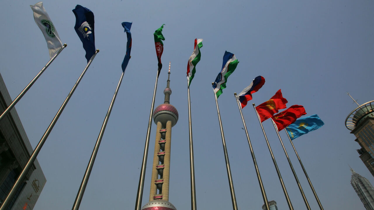 Flags of Shanghai Cooperation Organization member states fly in front of the Shanghai International Convention Center, where the SCO summit is held, Shanghai, China, June 11, 2006.