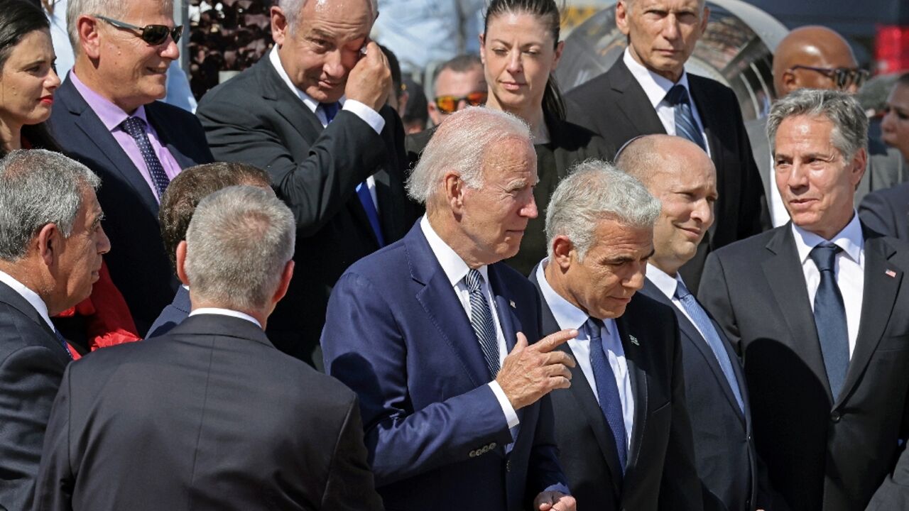 (front L to R) US President Joe Biden, Israel's caretaker Prime Minister Yair Lapid, outgoing Prime Minister Naftali Bennett, US Secretary of State Antony Blinken, former prime minister Benjamin Netanyahu (back 3rd L), and Transport Minister Merav Michaeli (2nd R)stand after posing for a commemorative picture at Israel's Ben Gurion Airport in Lod near Tel Aviv, on July 13, 2022. (front L to R) US President Joe Biden, Israel's caretaker Prime Minister Yair Lapid, outgoing Prime Minister Naftali Bennett, US Secretary of State Antony Blinken, former prime minister Benjamin Netanyahu (back 3rd L), and Transport Minister Merav Michaeli (2nd R)stand after posing for a commemorative picture at Israel's Ben Gurion Airport in Lod near Tel Aviv, on July 13, 2022.