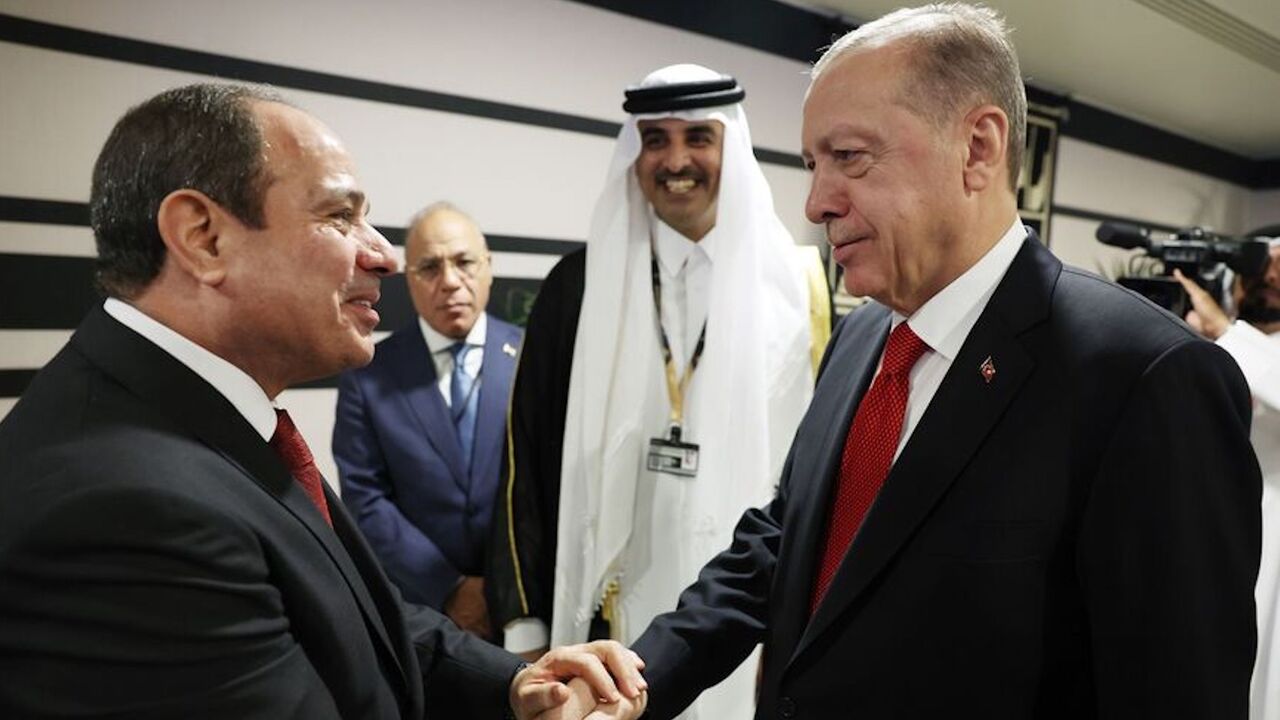 Recep Tayyip Erdogan shakes hands with Abdel Fattah el-Sisi in Qatar on Nov. 20, 2022. 