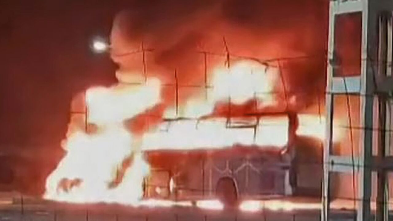 The passenger bus is seen in flames after the accident that killed more than 30 people in Algeria's southern desert, in an image grab from an online video The passenger bus is seen in flames after the accident that killed more than 30 people in Algeria's southern desert, in an image grab from an online video