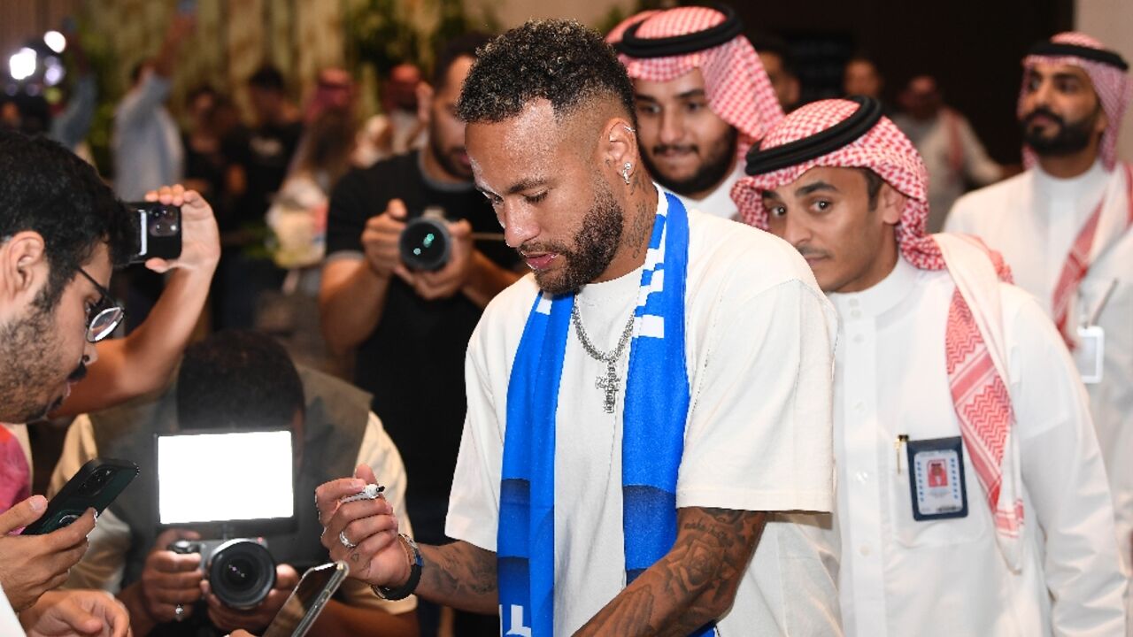 Neymar signs autographs as he arrives in Riyadh Neymar signs autographs as he arrives in Riyadh