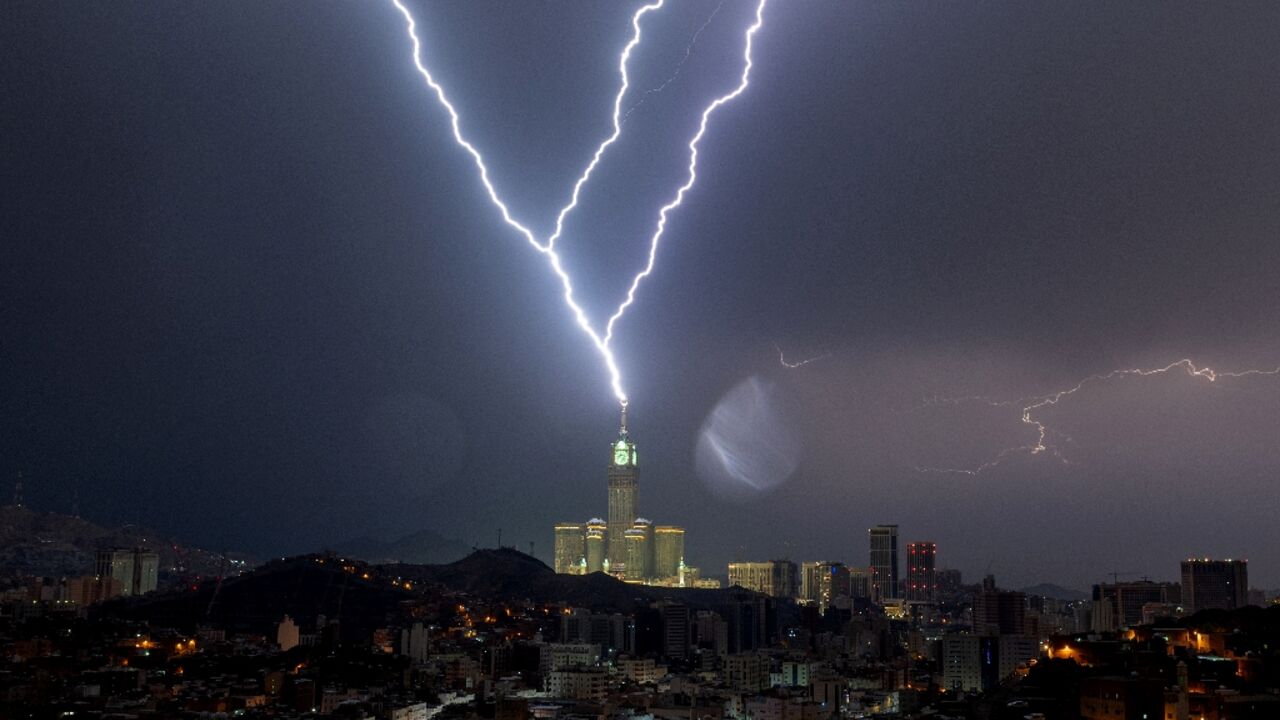Lightning strikes the clock tower in the Saudi city of Mecca, home to Islam's holiest site Lightning strikes the clock tower in the Saudi city of Mecca, home to Islam's holiest site