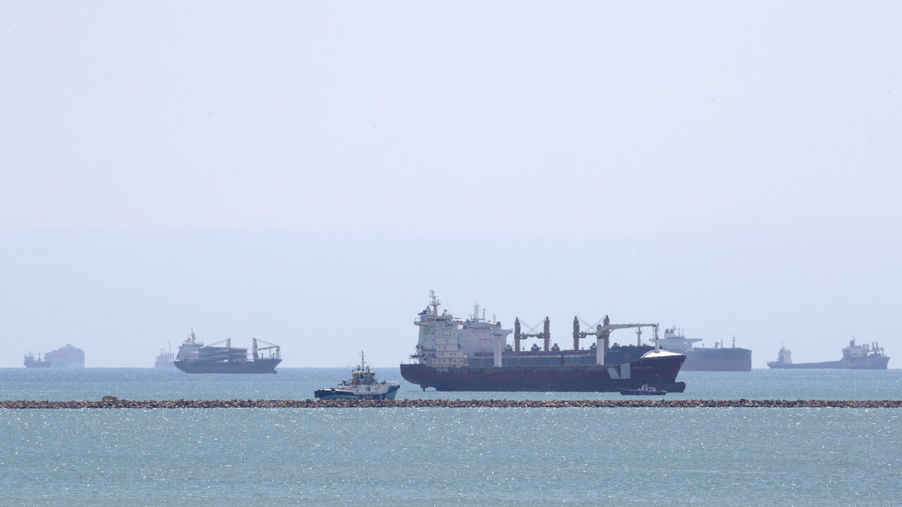 This picture taken on March 28, 2021 shows the Gibraltar-flagged container ship Indian Express (C-front) and the Panama-flagged container ship Elegant (C-behind) near the entrance of the Suez Canal, by Egypt's Red Sea port city of Suez. (Photo by Ahmed HASAN / AFP) (Photo by AHMED HASAN/AFP via Getty Images)