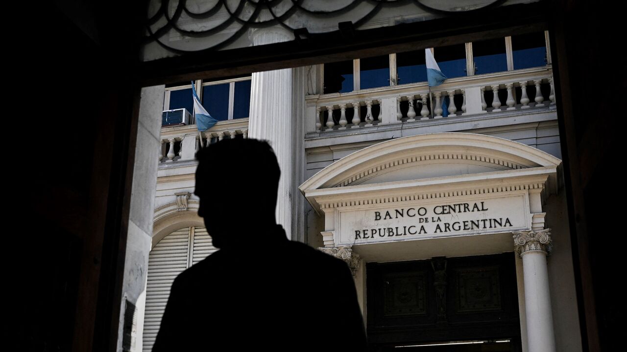 A man stands in front of Argentina's Central Bank in Buenos Aires, on May 15, 2023.