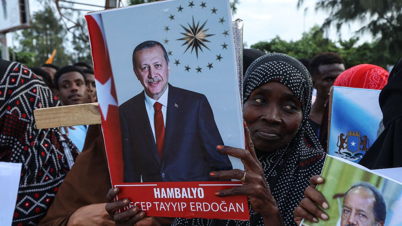 Somalis celebrate the victory of Turkish President Recep Tayyip Erdogan after he won the presidential run-off election during the celebrations organised by the government in Mogadishu, on May 29, 2023. 