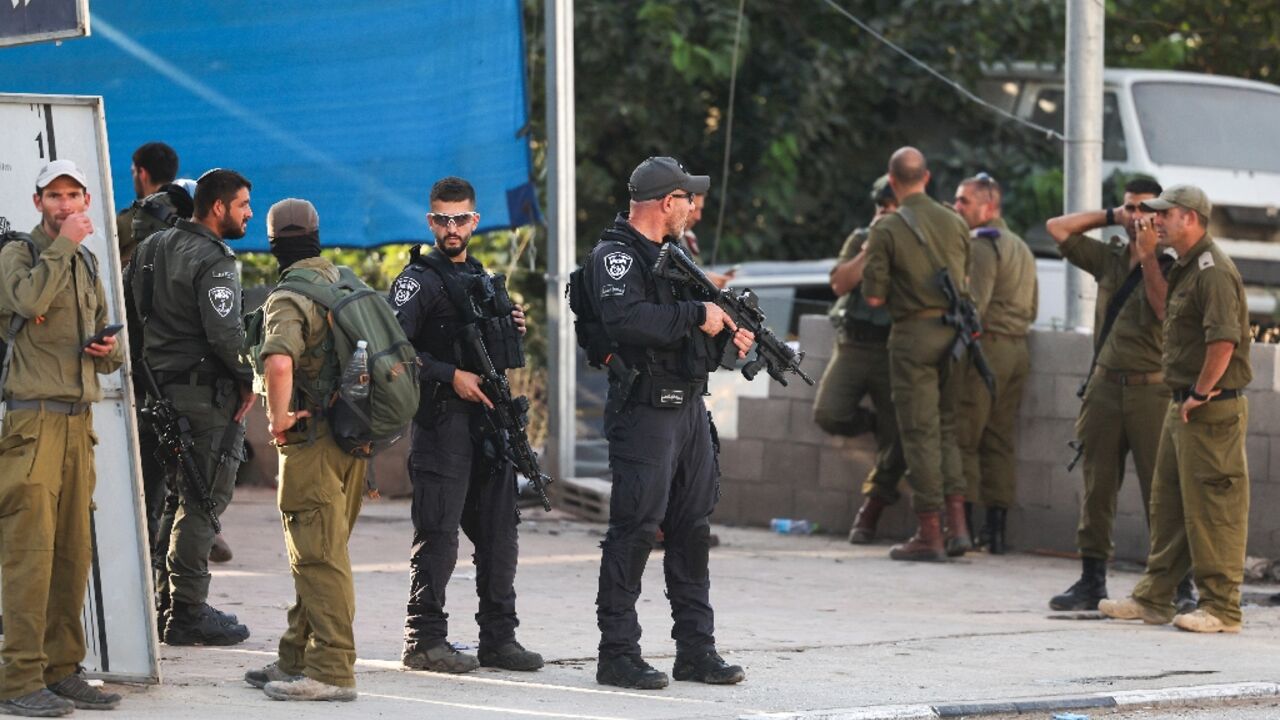 Israeli security forces stand guard at the site of Saturday's attack in the town of Huwara in the occupied West Bank Israeli security forces stand guard at the site of Saturday's attack in the town of Huwara in the occupied West Bank