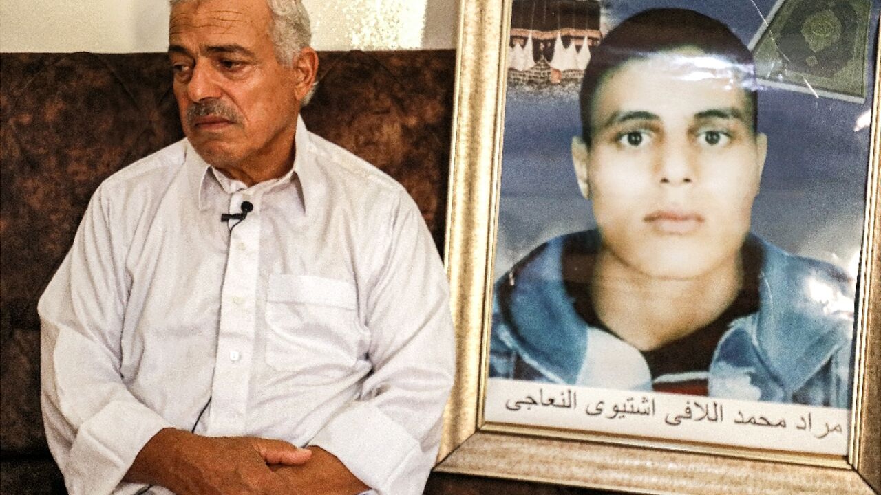 Mohamad Allafi with the portrait of his son Mourad Mohamad Allafi with the portrait of his son Mourad