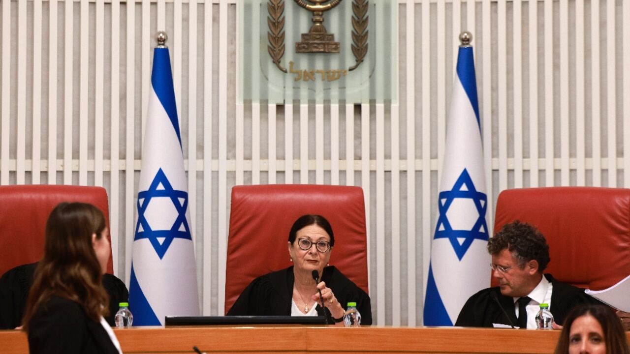 Israel's Supreme Court president Esther Hayut and judges hear petitions against a law restricting how a prime minister can be removed from office