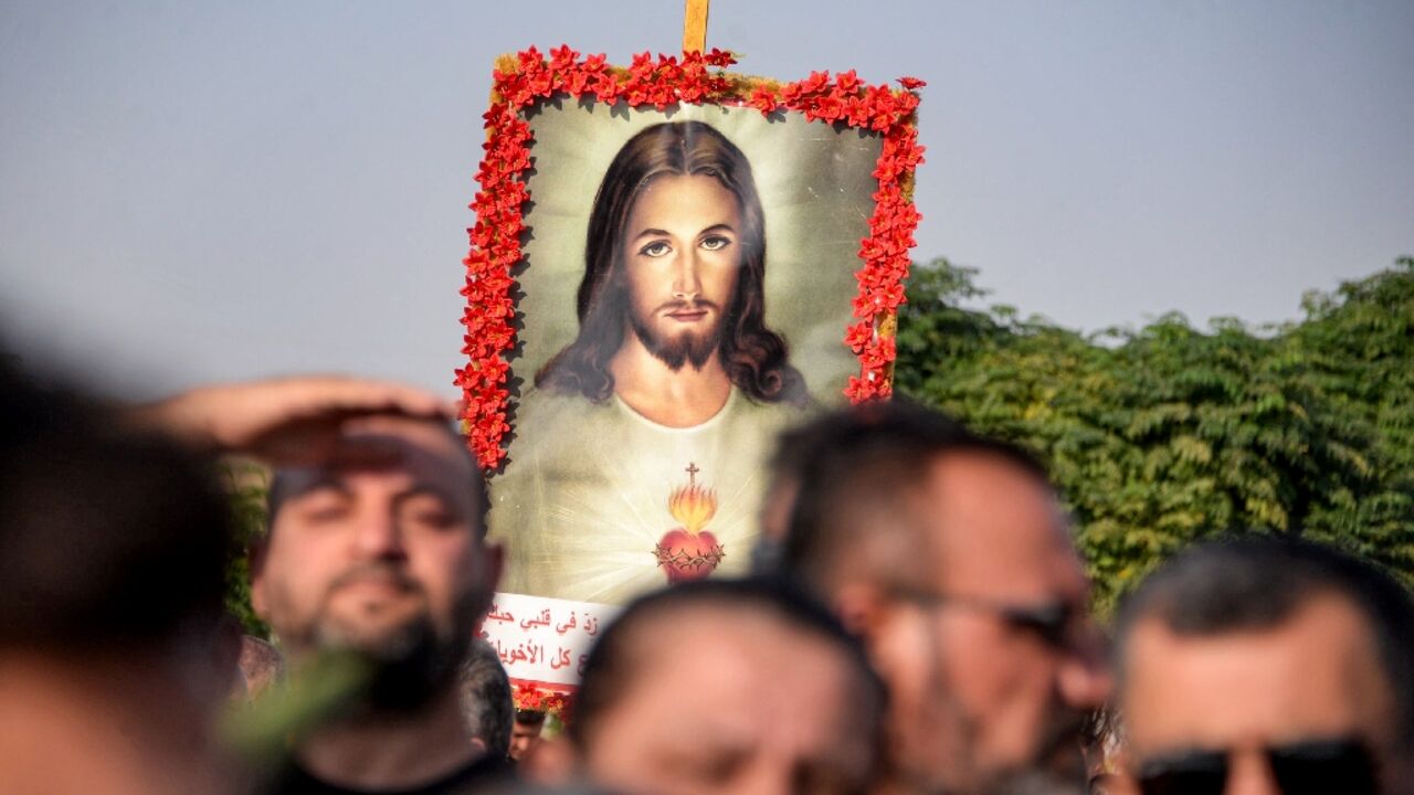 Around 20 coffins covered in satin or bouquets of flowers were carried through the crowd on the shoulders of men