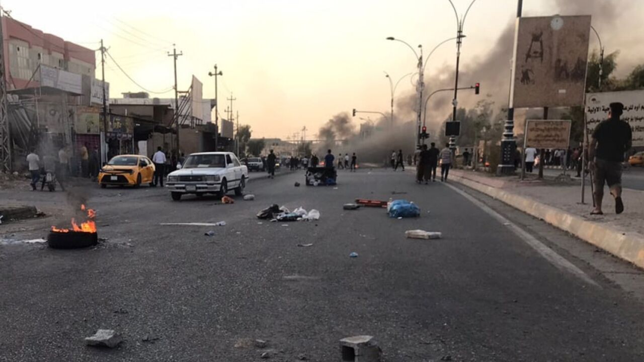 Iraqi protesters block a road following protests in the multi-ethnic Iraqi city of Kirkuk