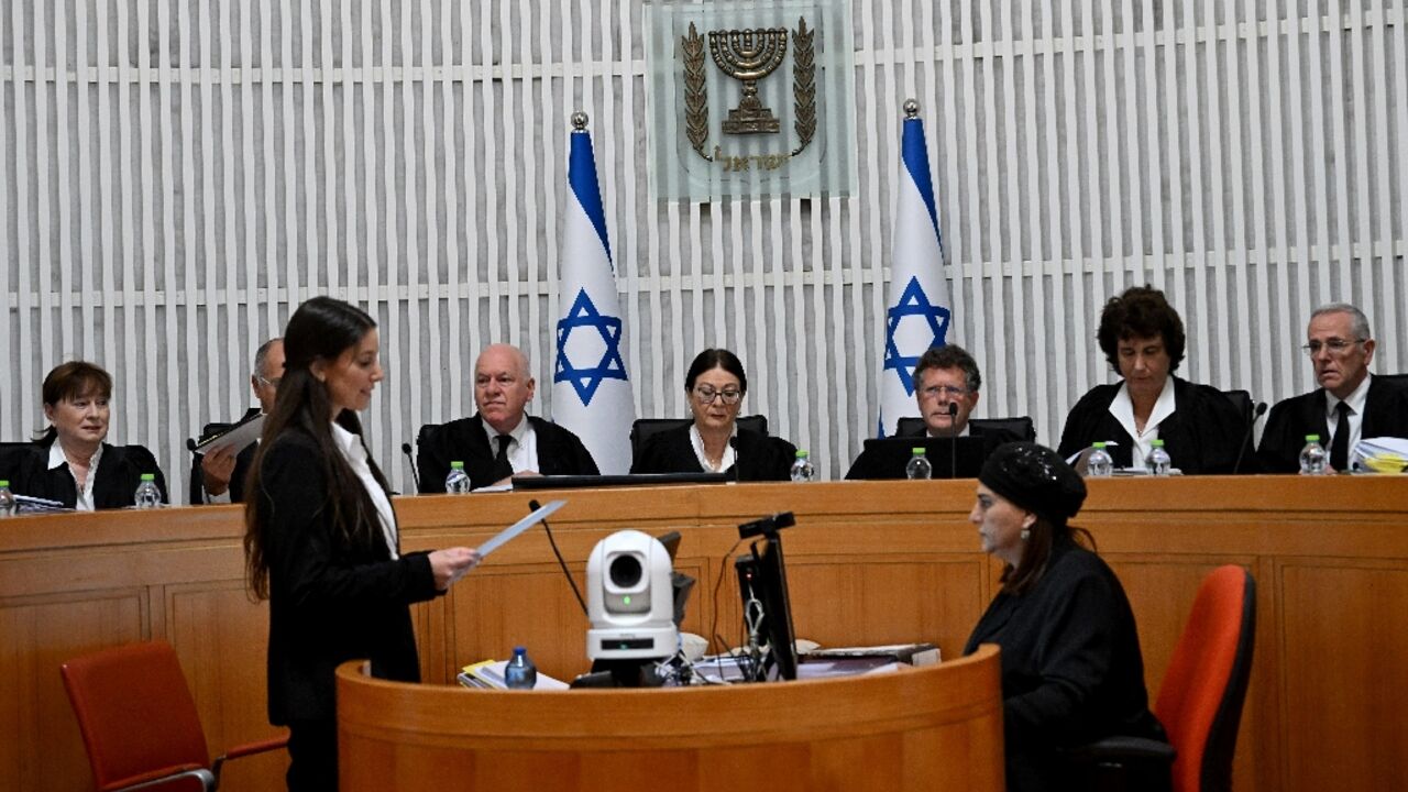 Israeli Supreme Court president Esther Hayut and all 15 judges assemble to hear petitions against a key element of the government's controversial judicial reforms