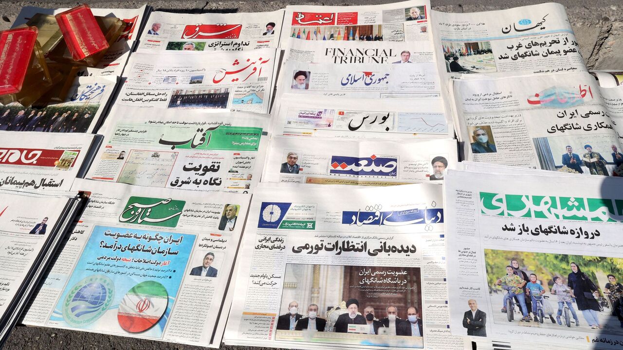 A picture shows daily newspapers on sale at a kiosk in the capital Tehran, on Sept. 18, 2021.
