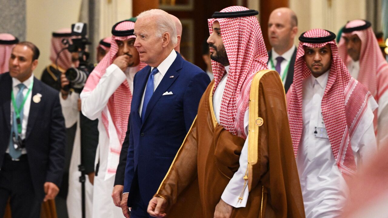 US President Joe Biden (L) and Saudi Crown Prince Mohammed bin Salman (R) arrive for the family photo during the Jeddah Security and Development Summit (GCC+3) at a hotel in Saudi Arabia's Red Sea coastal city of Jeddah on July 16, 2022.