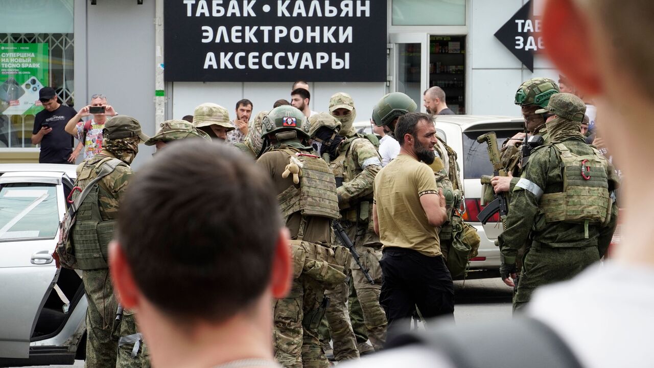 Members of Wagner group inspect a car in a street of Rostov-on-Don, on June 24, 2023. President Vladimir Putin on June 24, 2023 said an armed mutiny by Wagner mercenaries was a "stab in the back" and that the group's chief Yevgeny Prigozhin had betrayed Russia, as he vowed to punish the dissidents. Prigozhin said his fighters control key military sites in the southern city of Rostov-on-Don. (Photo by STRINGER / AFP) (Photo by STRINGER/AFP via Getty Images)