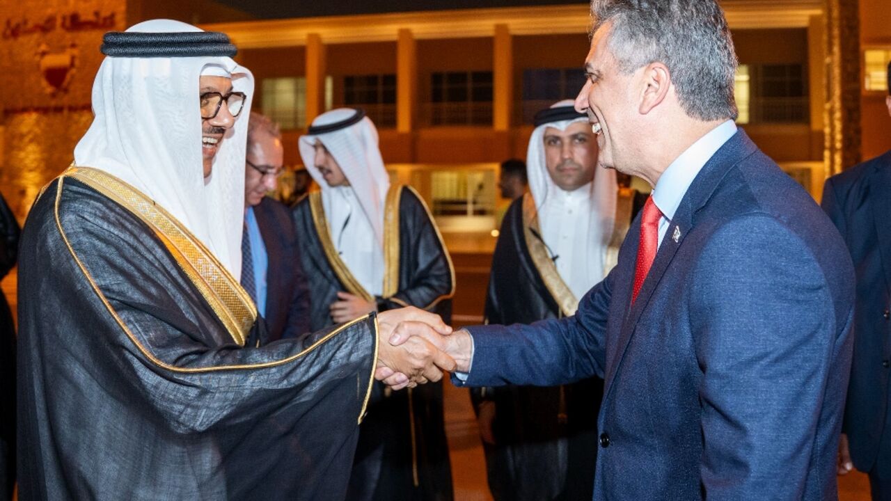 Bahrain Foreign Minister Abdullatif bin Rashid al-Zayani welcoming his Israeli counterpart Eli Cohen to Manama