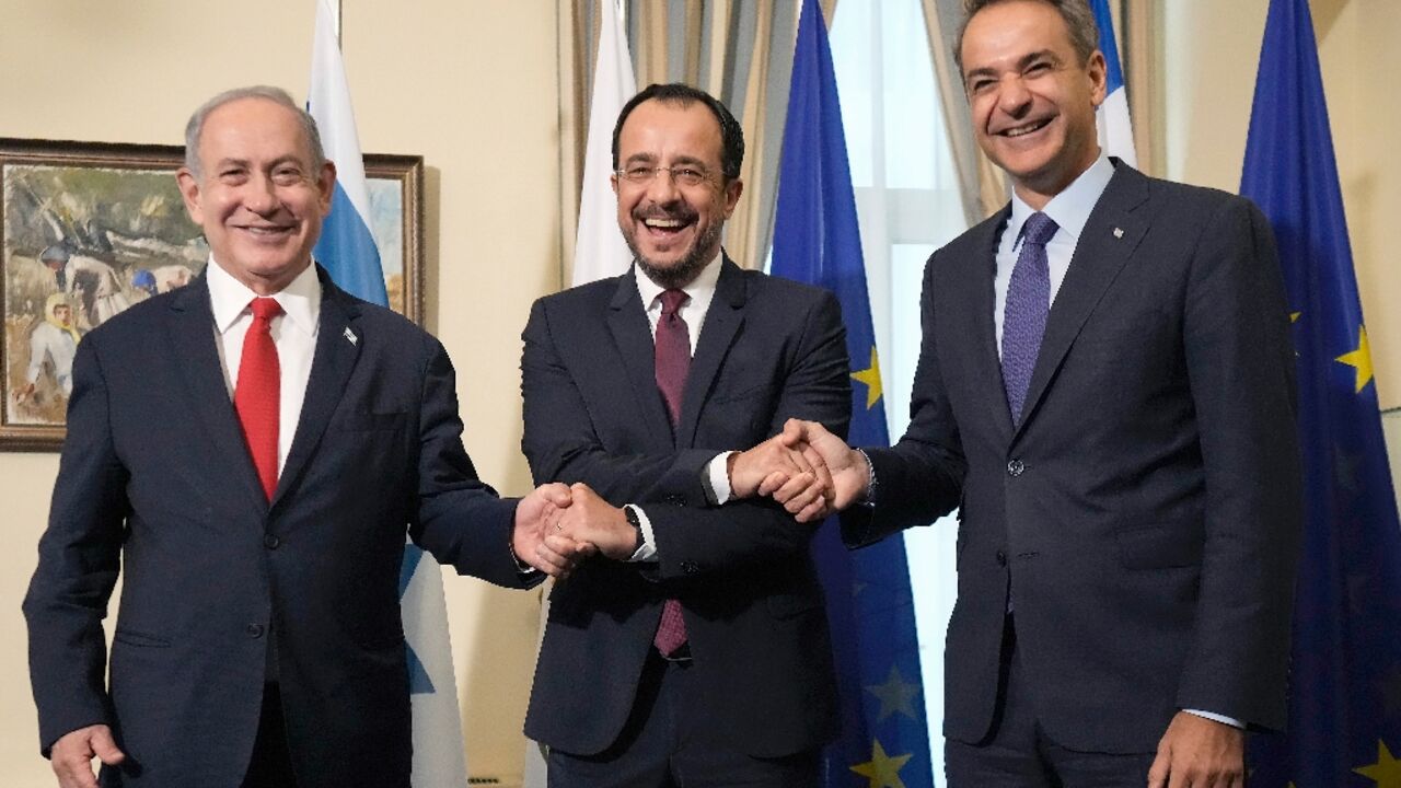 Cyprus President Nikos Christodoulides (C) with Greek Prime Minister Kyriakos Mitsotakis (R) and Israeli Prime Minister Benjamin Netanyahu