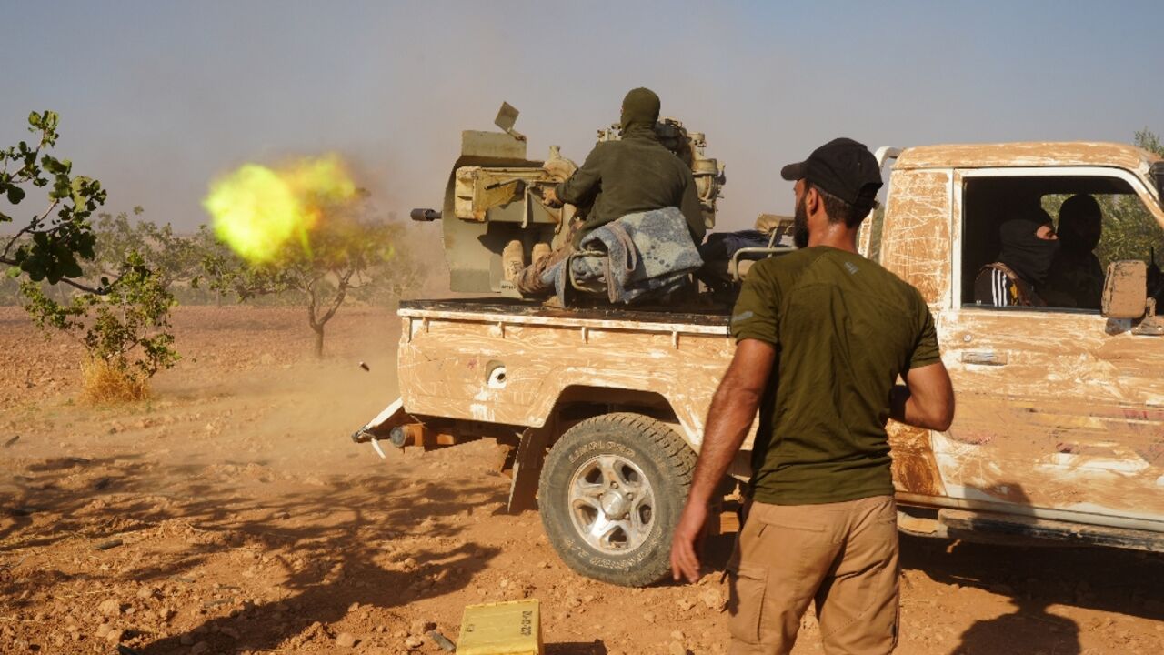 Syrian Arab fighters on the  Turkish-held outskirts of Manbij, in northwestern Syria, during fighting against the Kurdish-led Syrian Democratic Forces (SDF) on September 4, 2023