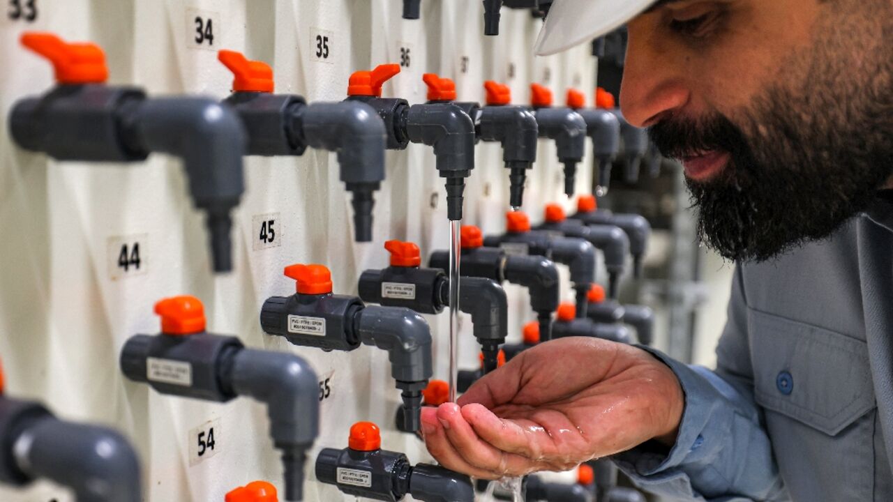 General manager Mohamed Ali al-Qahtani checks the quality of the ouput at the Ras al-Khair desalination plant