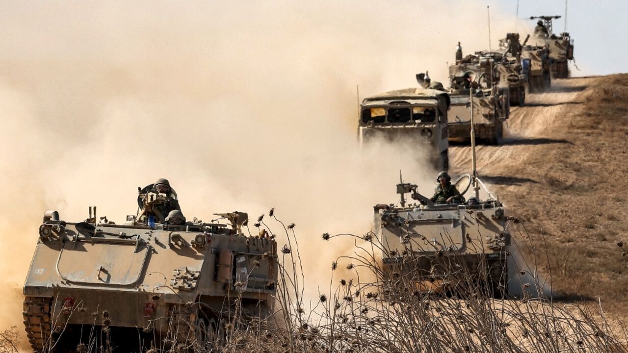 Israeli army infantry fighting vehicles deploy along the border with the Gaza Strip in southern Israel, ahead of an expected ground offensive in the Palestinian territory Israeli army infantry fighting vehicles deploy along the border with the Gaza Strip in southern Israel, ahead of an expected ground offensive in the Palestinian territory