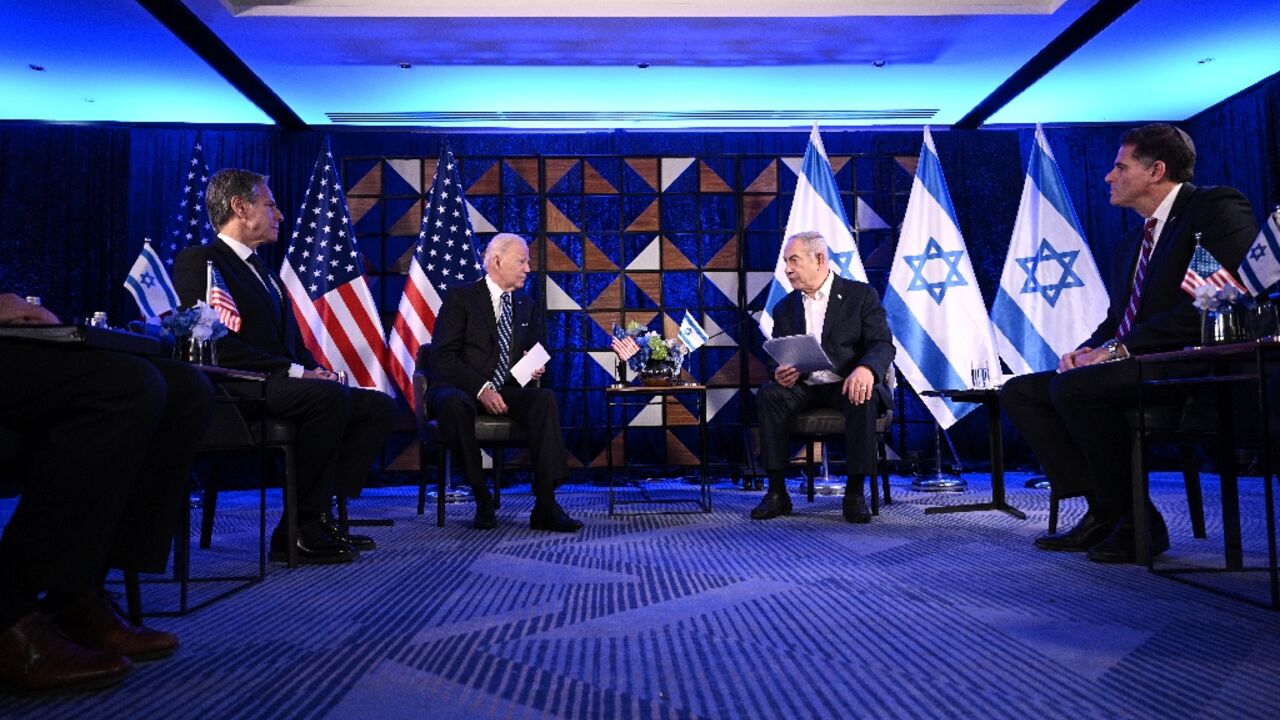 US Secretary of State Antony Blinken listens on as US President Joe Biden and Israel's Prime Minister Benjamin Netanyahu wait to make statements before a meeting in Tel Aviv