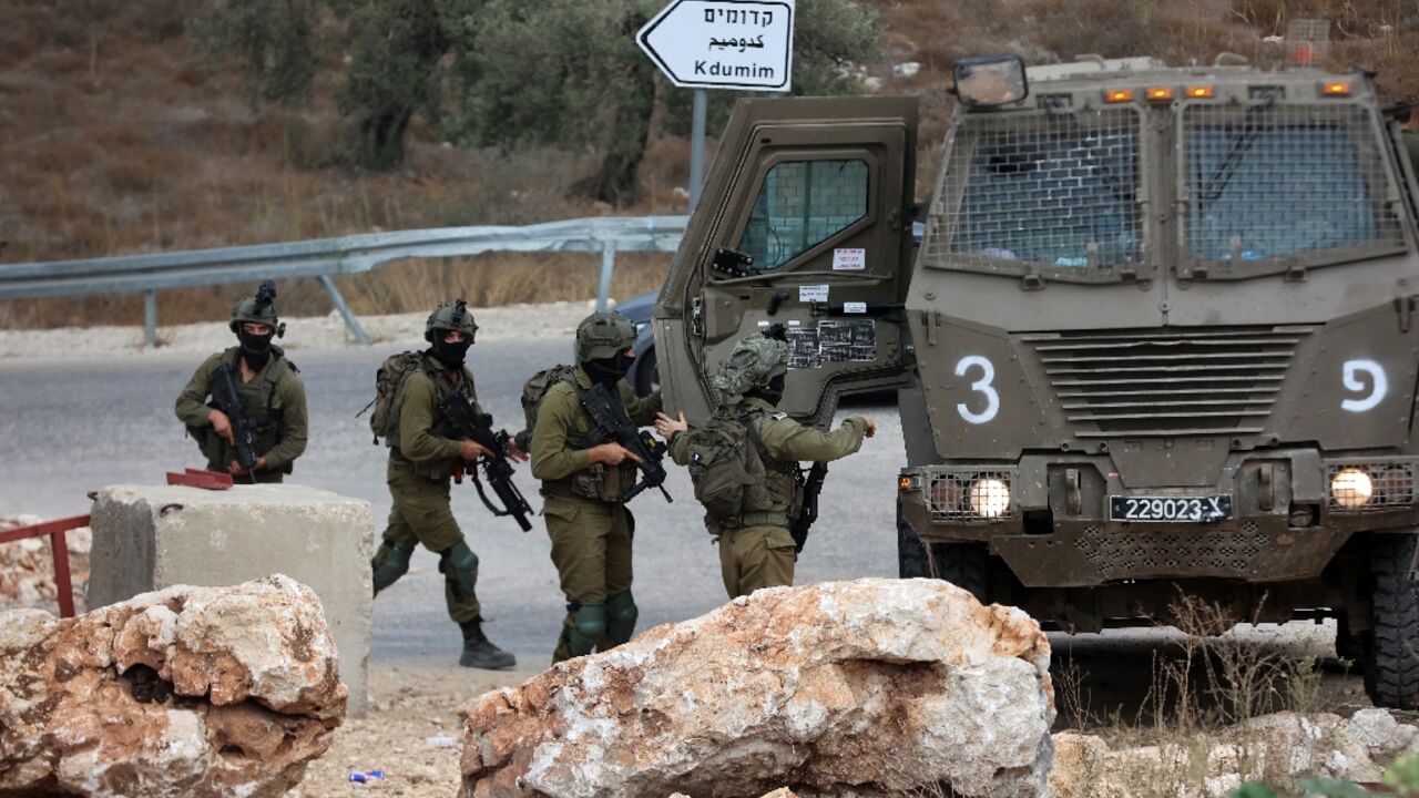 Israeli soldiers patrol near the West Bank city of Tulkarm where two Palestinians were reportedly killed during clashes with Israeli forces Israeli soldiers patrol near the West Bank city of Tulkarm where two Palestinians were reportedly killed during clashes with Israeli forces