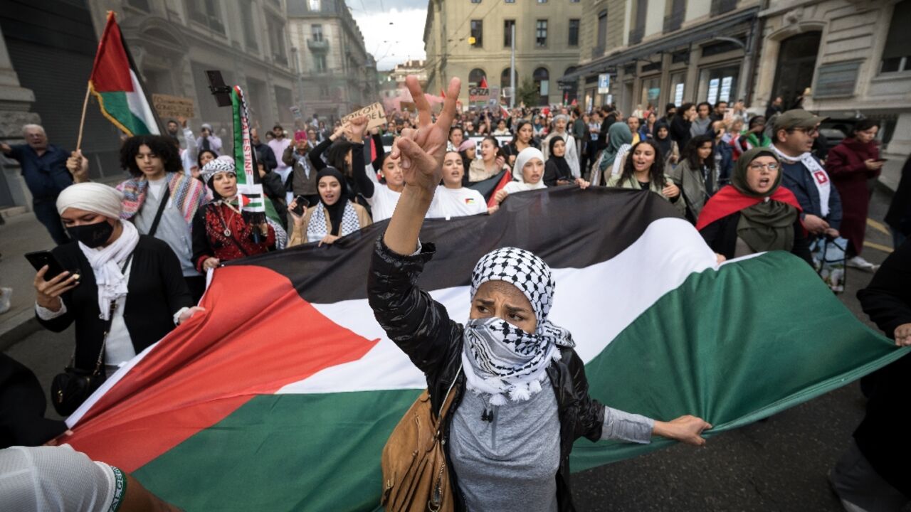 Demonstrators in Geneva carried a giant Palestinian flag during a pro-Palestinian rally in the city centre Demonstrators in Geneva carried a giant Palestinian flag during a pro-Palestinian rally in the city centre