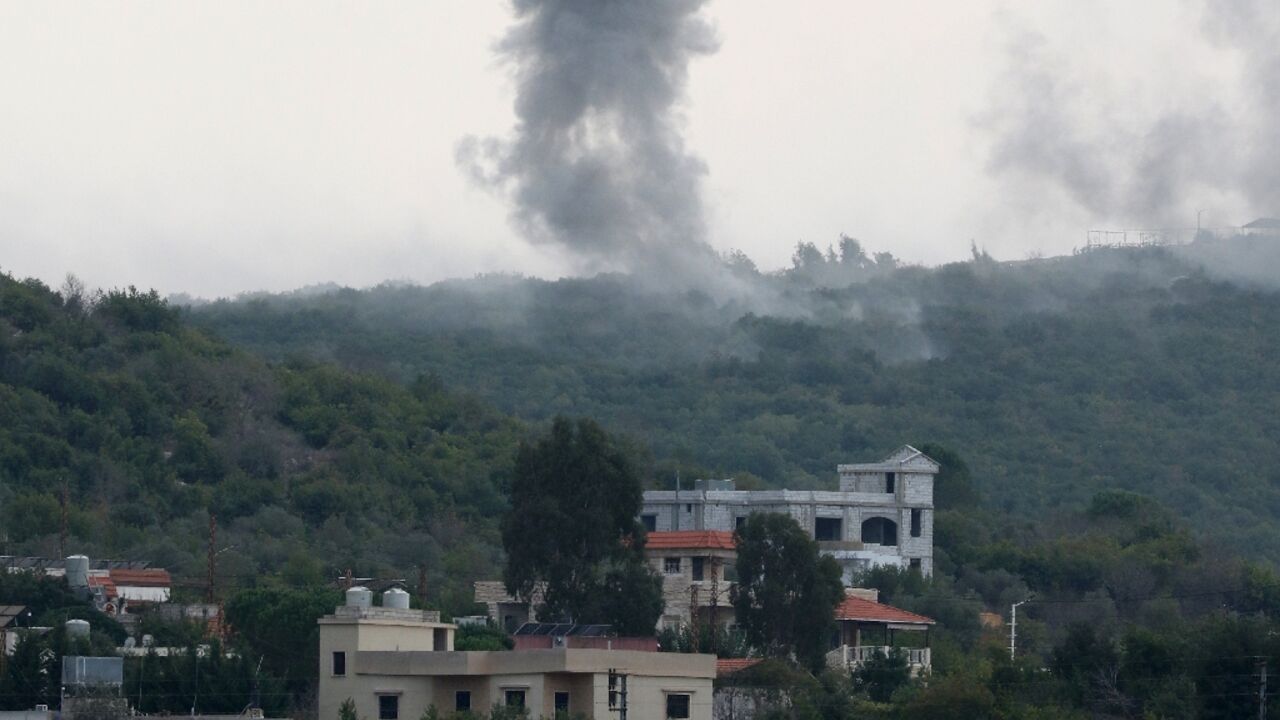 Smoke billows following Israeli artillery bombing on the outskirts of the southern Lebanese border village of Aita al-Shaab Smoke billows following Israeli artillery bombing on the outskirts of the southern Lebanese border village of Aita al-Shaab