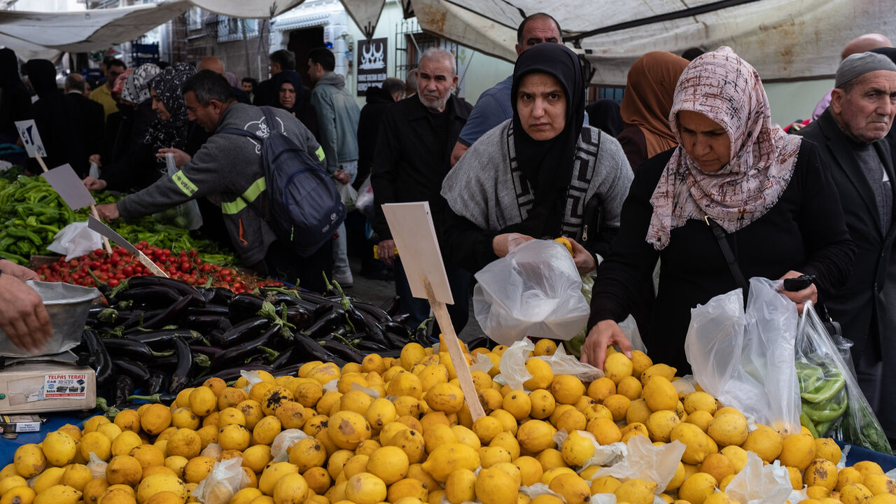 People shop at a local street market, Istanbul, Turkey, May 3, 2023.