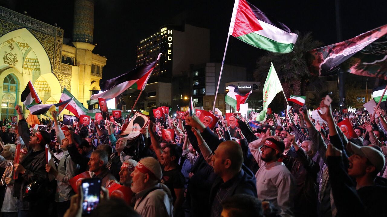 Iranians attend a gathering in Tehran on October 7, 2023, to express their solidarity with Palestine after Hamas militants launched a deadly air, land and sea assault into Israel from the Gaza Strip. A senior adviser to Iran's supreme leader Ayatollah Ali Khamenei voiced support for a deadly attack by Hamas on Israel, calling it a "proud operation". (Photo by AFP) (Photo by -/AFP via Getty Images)