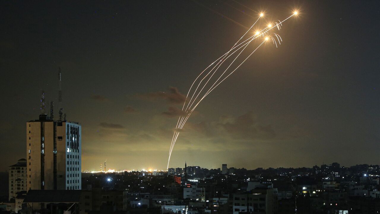 TOPSHOT - Israel's Iron Dome air defence system intercepts rockets launched from Gaza on October 11, 2023. Israel kept up its bombardment of Hamas targets in the Gaza Strip on October 11, as Prime Minister Benjamin Netanyahu and a political rival announced an emergency government for the duration of the conflict that has killed thousands. (Photo by Bashar TALEB / AFP) (Photo by BASHAR TALEB/AFP via Getty Images)