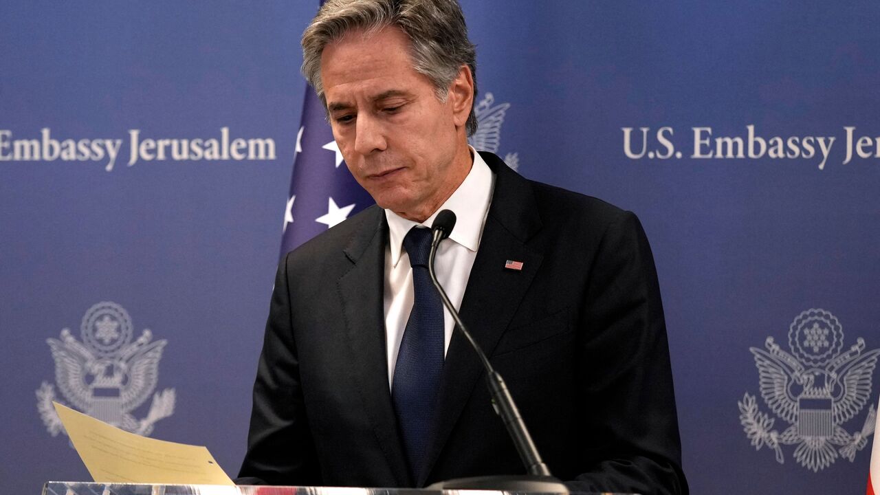 US Secretary of State Antony Blinken gathers his notes after speaking during a press conference in Tel Aviv, on October 17, 2023, after an overnight meeting with Israeli Prime Minister Benjamin Netanyahu. US President Joe Biden will pay a solidarity visit to Israel on October 18, 2023 following the Hamas attacks, Secretary of State Antony Blinken announced October 17, 2023. US President Joe Biden will travel from Israel to Amman on October 18, 2023 for talks with Palestinian leader Mahmud Abbas, Egyptian Pr