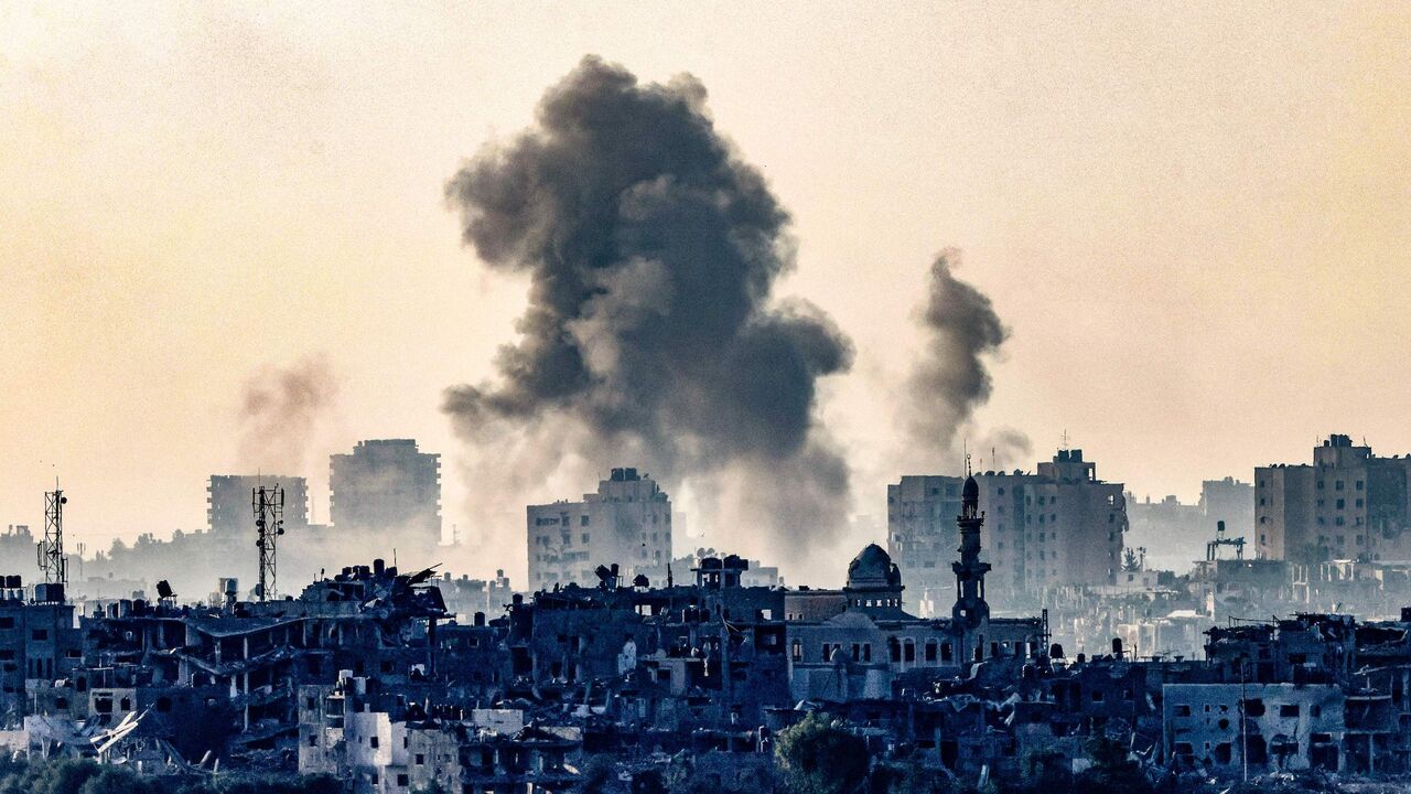 TOPSHOT - A picture taken from the southern Israeli city of Sderot on October 25, 2023, shows smoke ascending over the northern Gaza Strip following an Israeli strike, amid the ongoing battles between Israel and the Palestinian group Hamas. (Photo by RONALDO SCHEMIDT / AFP) (Photo by RONALDO SCHEMIDT/AFP via Getty Images)