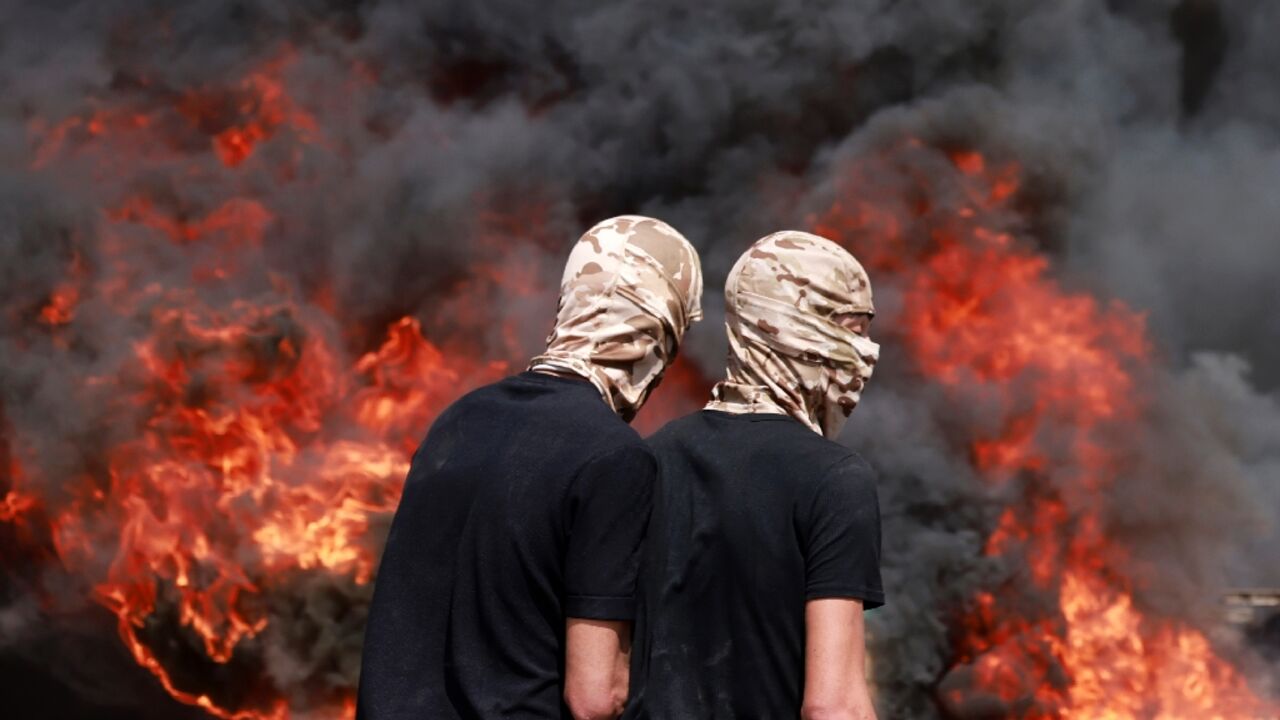 Palestinians burned tyres in clashes with Israeli security forces during Dmidi's funeral Palestinians burned tyres in clashes with Israeli security forces during Dmidi's funeral