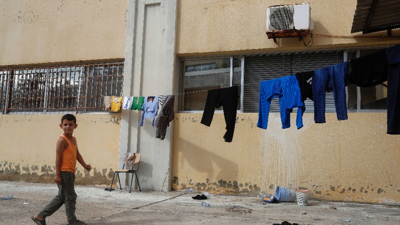 Some 4,000 people have fled south Lebanon to shelter in Tyre, with many packing into repurposed public schools Some 4,000 people have fled south Lebanon to shelter in Tyre, with many packing into repurposed public schools
