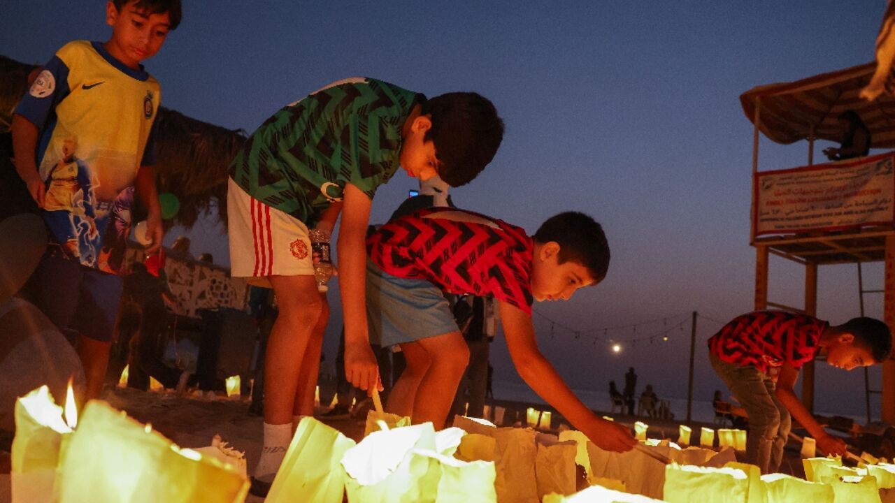 Last week, children light candles at a vigil in memory of Lebanese Journalist Issam Abdallah and in support of Palestinians