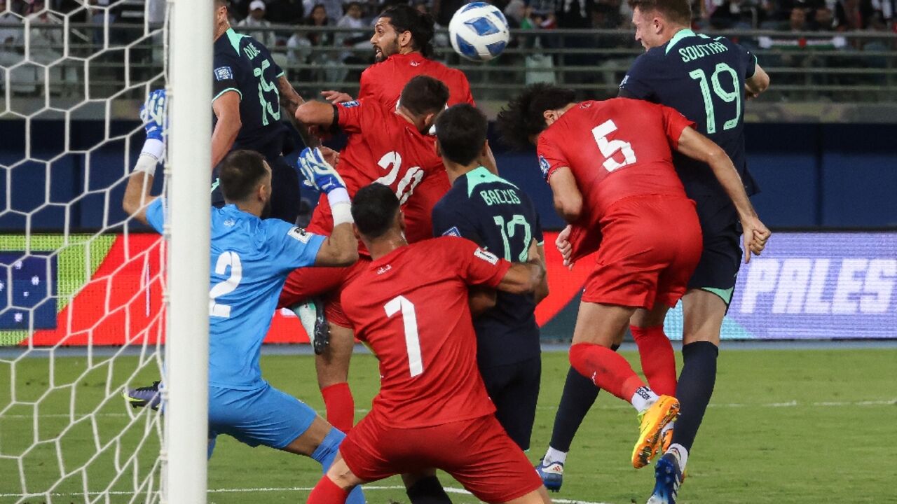 Australia's Harry Souttar (R) scores against Palestine in a 2026 FIFA World Cup AFC qualifier at Jaber Al-Ahmad International Stadium in Kuwait City Australia's Harry Souttar (R) scores against Palestine in a 2026 FIFA World Cup AFC qualifier at Jaber Al-Ahmad International Stadium in Kuwait City