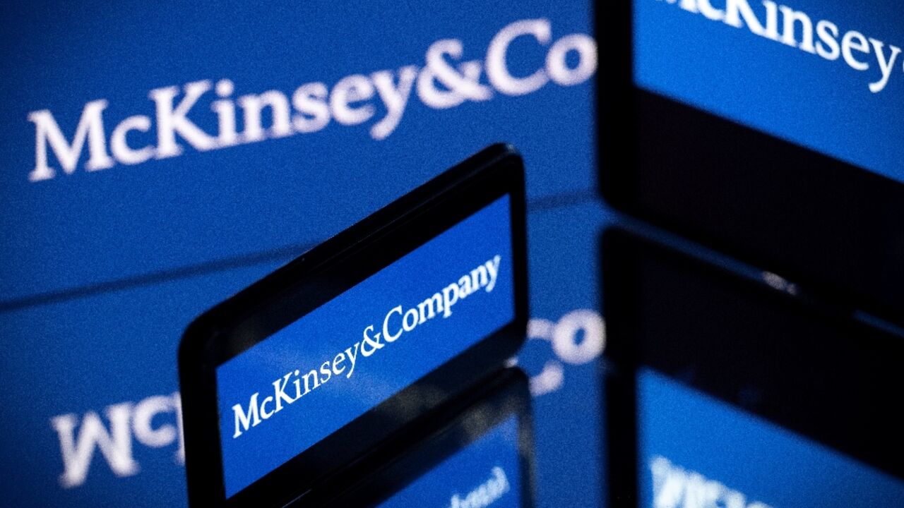 Screens displaying the logo of US-based McKinsey & Company, the world's top management consulting firm Screens displaying the logo of US-based McKinsey & Company, the world's top management consulting firm