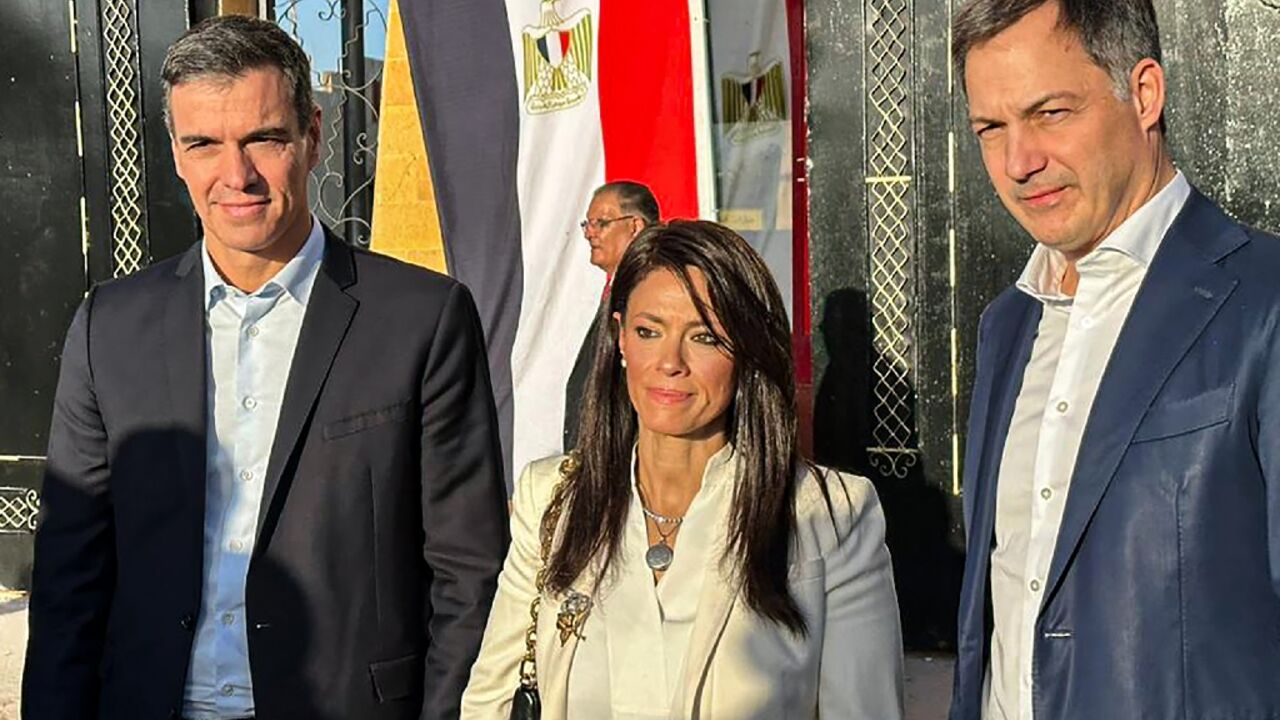 Spanish Prime Minister Pedro Sanchez (L) and his Belgian counterpart Alexander De Croo (R) visit the Rafah border crossing between Egypt and Gaza, accompanied by Egyptian International Cooperation Minister Rania al-Mashat