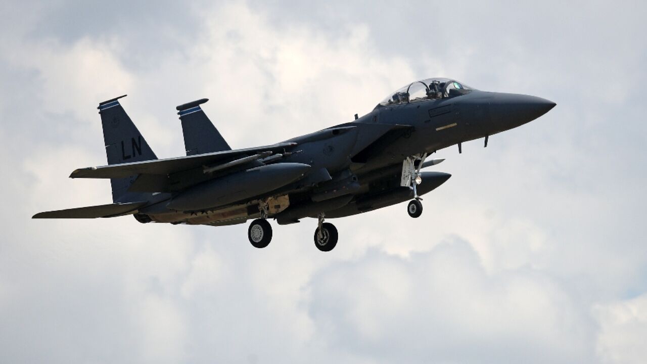 US Defense Secretary Lloyd Austin said two American F-15 warplanes -- such as this one pictured in June 2020 -- struck an Iran-linked weapons storage facility in Syria US Defense Secretary Lloyd Austin said two American F-15 warplanes -- such as this one pictured in June 2020 -- struck an Iran-linked weapons storage facility in Syria